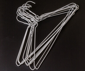 Stack of white wire clothes hangers