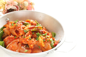 Korean cooking, chilli sauce marinated chicken in stainless steel pan