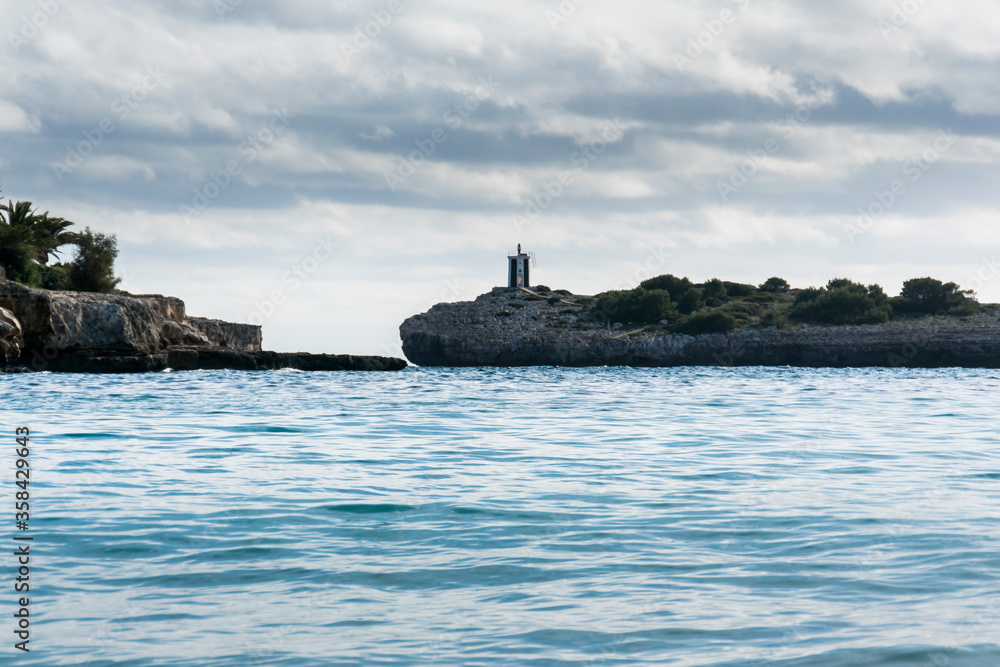 Wall mural Sea and coast landscape with lighthouse in Porto Cristo