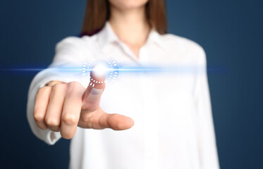 Woman pressing button on virtual screen, closeup