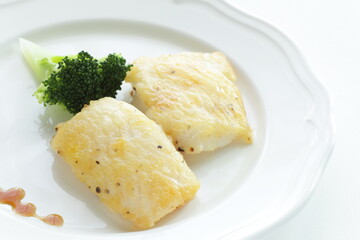 homemade black pepper cod fish fillet served with broccoli