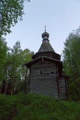 Russia, Karelia: White nights. Dawn on Lake Muezero. Trinity Monastery on Trinity Island, old wooden church of St. Nicholas.