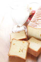 Sliced orange bread on wooden board with copy space