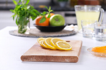 Slice lemon on the wooden stand.