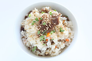 Japanese food, beff and carrot mixed rice with sesame and spring onion