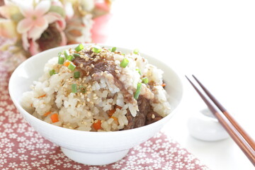 Japanese food, beff and carrot mixed rice with sesame and spring onion