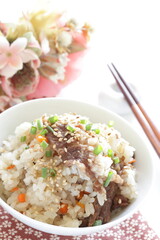 Japanese food, beff and carrot mixed rice with sesame and spring onion