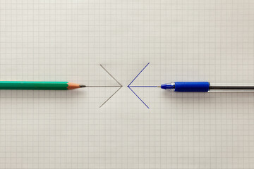Pencil and ballpoint pen lie on a sheet of paper, arrows are drawn on the paper.