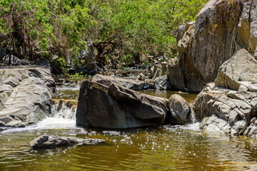 Naklejka na ściany i meble Fresh water creek and waterfall in Kroombit Tops National Park, Queensland