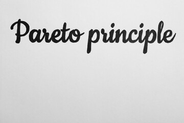 Fototapeta premium Words PARETO PRINCIPLE on white background, top view. Space for text
