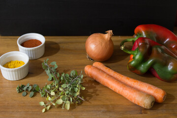 vegetables and spices on wood