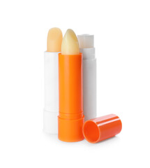 Sun protection lip balms on white background