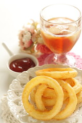 Obraz na płótnie Canvas Fast food, onion rings on dish for unhealthy food