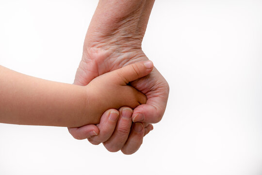 Grandmother And Granddaughter Hands On White Background