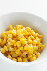 sweet corn in white bowl with copy space for food ingredient