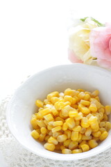 Prepared sweet corn in bowl with copy space