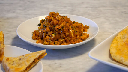 A plate of fried pickled mustard on marble table, breakfast side dish