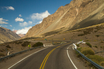 Travel. Rural highway. The asphalt  road curve along the mountains and desert. 