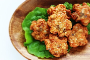 Chinese food, fish cake on lettuce with copy space
