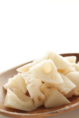 Chopped lotus root on wooden plate for prepared food ingredient