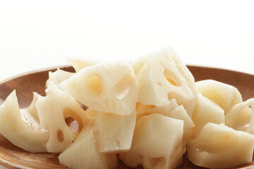 Chopped lotus root on wooden plate for prepared food ingredient
