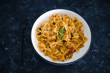plant-based food, vegan garlic tahini sauce pasta with mediterranean vegetables