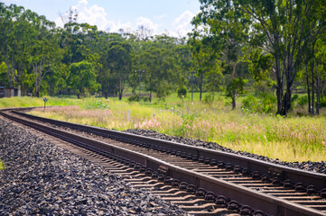Rail tracks in Queensland countryside during summer