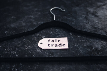ethical fashion concept, velvet clothes hanger with Fair Trade label on it
