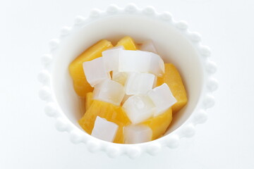 canned peach and Nata de coco in bowl for healthy dessert