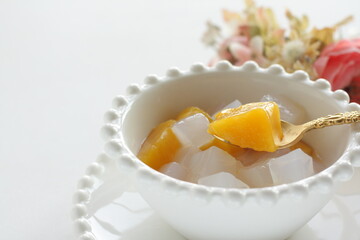 canned peach and Nata de coco in bowl for healthy dessert