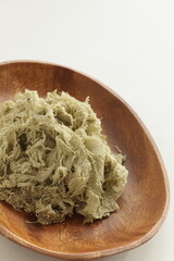 Japanese food ingredient, sweet Kombu on wooden plate