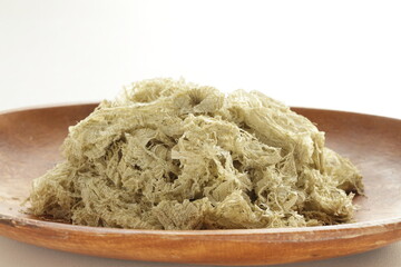 Japanese food ingredient, sweet Kombu on wooden plate