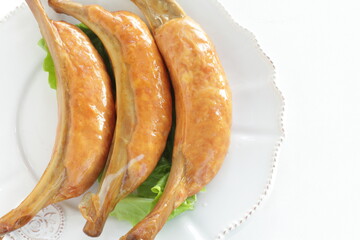 Food ingredient, sausage with bone  on lettuce with copy space 