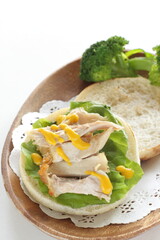 Chicken and mustard sauce in English muffin sandwich for comfort breakfast 