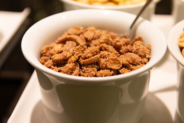 Bowl of sweet nuts snack at restaurant buffet cereal corner.