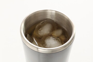 Ice and water in thermo cup for summer drink