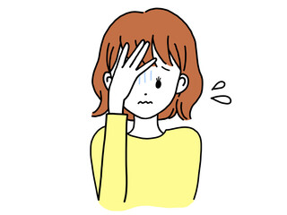 頭を抱える不安そうな若い女性