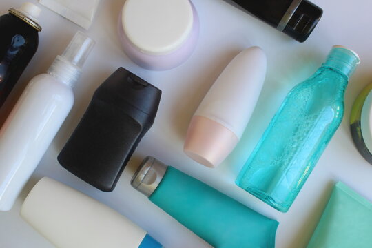 Against the background of a lot of different bottles and bottles of cosmetics