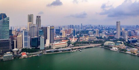 View of the bay and city skyline with skyscrapers at sunrise in Singapore