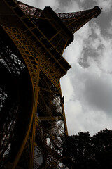 eiffel tower in paris, color pop artistic image from close distance with colorful tower and grey sky