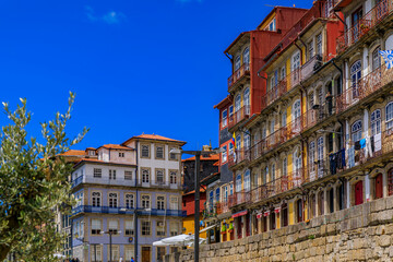 Traditional house facades decorated with Portuguese azulejo tiles in the famous Ribeira neighborhood in Porto, Portugal