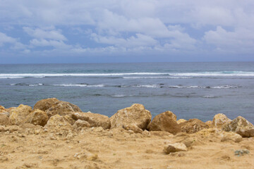 beach side against the foreground of white rocks
