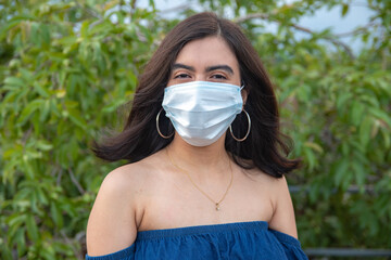 Latin American girl wearing surgical mask