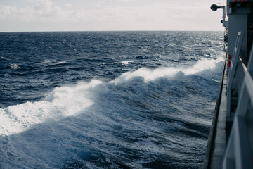 A cruise ship cuts through the waves in the Indian ocean.