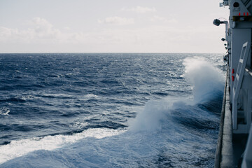 A cruise ship cuts through the waves in the Indian ocean.