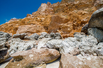 It's Stones on the calm coast of the ocean