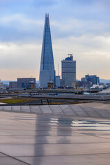 View of London skyline and the Shard skyscraper from One New Change shopping centre on a cloudy day in London, England