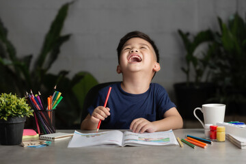Smart little asian boy having an idea while doing his homework.Learning and education of kid