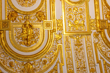 Fototapeta na wymiar Close-up of ornate gilded golden ceiling