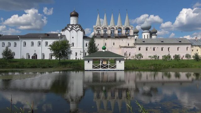 View of the bell tower of the Tikhvin assumption monastery on a July day. Leningrad region, Russia  